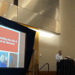 Hernando Rojas speaks at the Celebration of Jack McLeod at ICA.